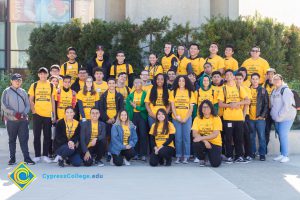 Group of Science, Engineering and Math students wearing yellow shirts.