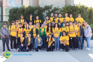 Group of Science, Engineering and Math students wearing yellow shirts.