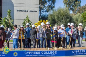 Group of people holding shovels at the SEM Groundbreaking event.