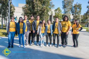 Group of Science, Engineering and Math students wearing yellow shirts.