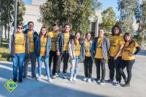 Group of Science, Engineering and Math students wearing yellow shirts.