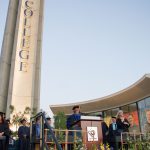 Commencement stage with part of campanile in the background.