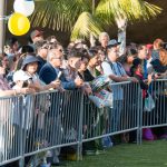 Crowd of spectators watching commencement.