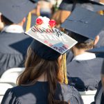 Decorated graduation cap during commencement.