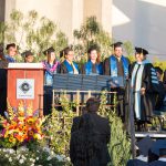 BSFS students on stage with Dr. Schilling and Dr. Marshall being recognized during commencement.