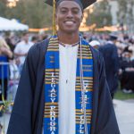 Legacy graduate wearing regalia and Legacy stole.