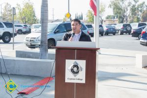 VRC Director, Juan Garcia at the podium with a microphone in his hand.