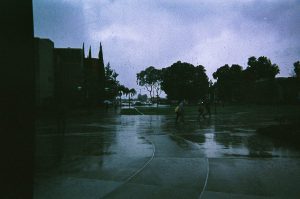 Students walking in the rain