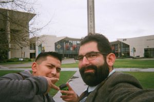 Two men smiling on campus