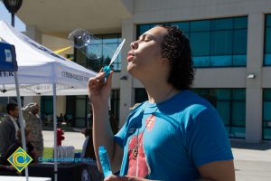 Male student blowing bubbles