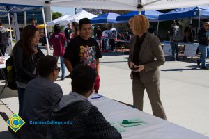 Dr. JoAnna Schilling standing at table with students