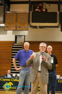 Former coach Don Johnson speaks as Swen Nater and Mark Eaton watch from behind.