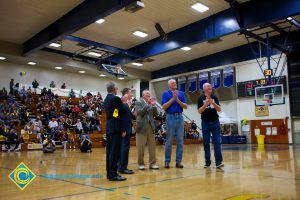 Swen Nater, Mark Eaton, Don Johnson, Rick Rams and Bob Simpson applaud as fans watch from the stands.