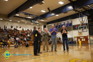 Swen Nater, Mark Eaton, Don Johnson, Rick Rams and Bob Simpson applaud as fans watch from the stands.