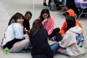 Students meditate at a stress-relieving event.