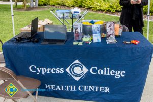 A Health Center table offers item at a stress-relieving event.