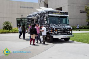 Students get food from a food truck.