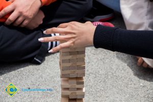 Students play Jenga at a stress-relieving event.