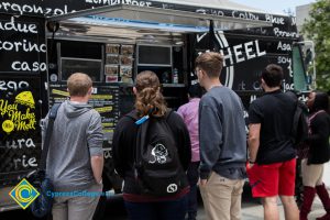 Students get food from a food truck.