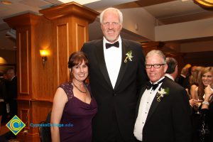 President Bob Simpson and wife Denise with former NBA player Mark Eaton.