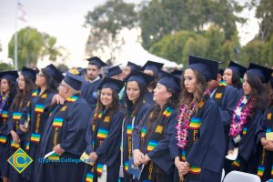 Graduates in their cap and gown at commencement.