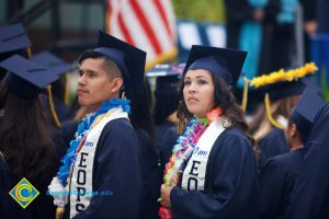 Graduates in their cap and gown at commencement.