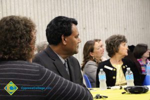 Staff seated during commencement reception.