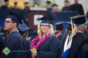 Graduates in their cap and gown at commencement.