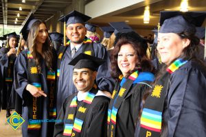 Dr. Therese Mosqueda-Ponce with graduating Puente students during the 48th Commencement.