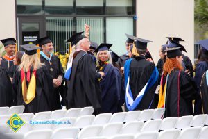 Graduates in their cap and gown at commencement.