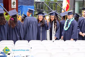 Graduates in their cap and gown at commencement.