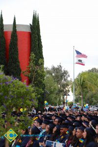 Graduates in their cap and gown at commencement.