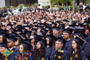 Graduates in their cap and gown at commencement.