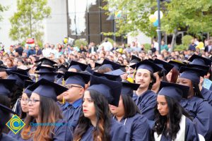 Graduates in their cap and gown at commencement.