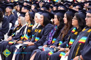 Graduates in their cap and gown at commencement.