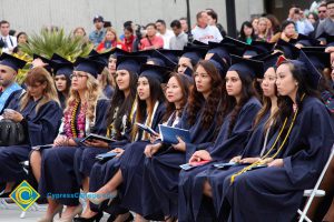 Graduates in their cap and gown at commencement.