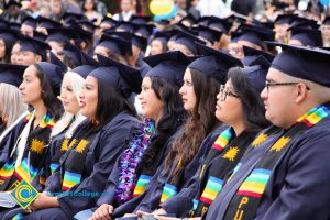 Graduates in their cap and gown at commencement.