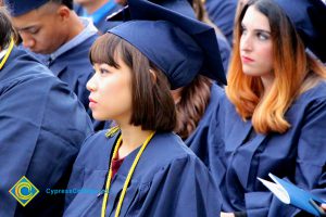 Graduates in their cap and gown at commencement.