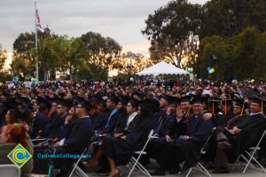 Graduates in their cap and gown at commencement.