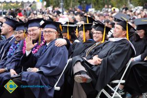 Graduates in their cap and gown at commencement.