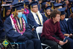 Graduates in their cap and gown at commencement.