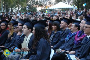 Graduates in their cap and gown at commencement.