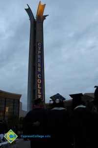The campanile lit up with a Cypress College banner.