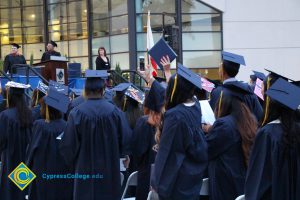 Graduates in their cap and gown at commencement.