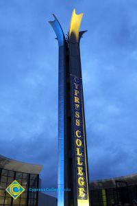 The campanile lit up with a Cypress College banner.