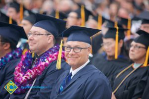 Graduates in their cap and gown at commencement.