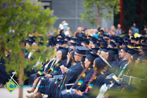 Graduates in their cap and gown at commencement.