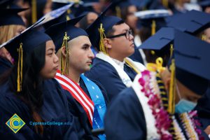 Graduates in their cap and gown at commencement.