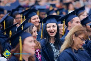 Graduates in their cap and gown at commencement.