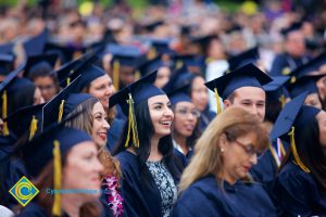 Graduates in their cap and gown at commencement.